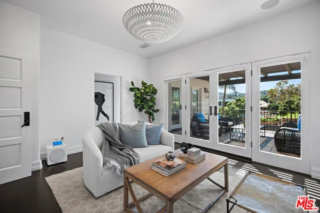 a spacious bedroom with a large bed and a large window