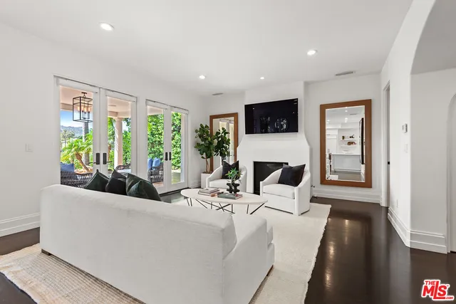 a large bedroom with a large bed and a large window