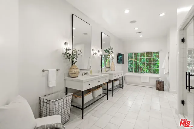 a workspace with furniture a rug and a window