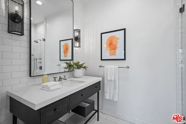 a view of a house with a yard and palm trees