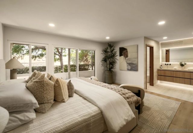 a bedroom with a bed and a chair