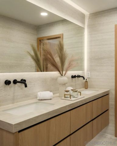 a kitchen with cabinets and stainless steel appliances