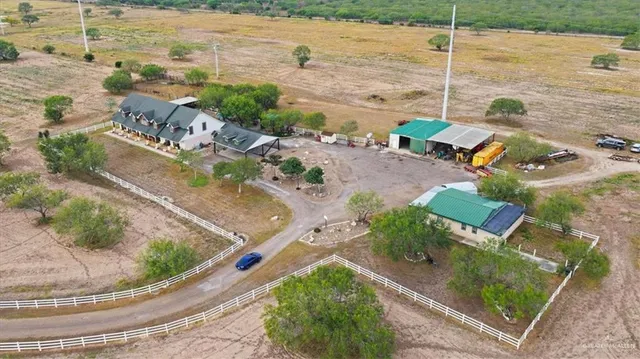 a workspace with wooden floor and a rug