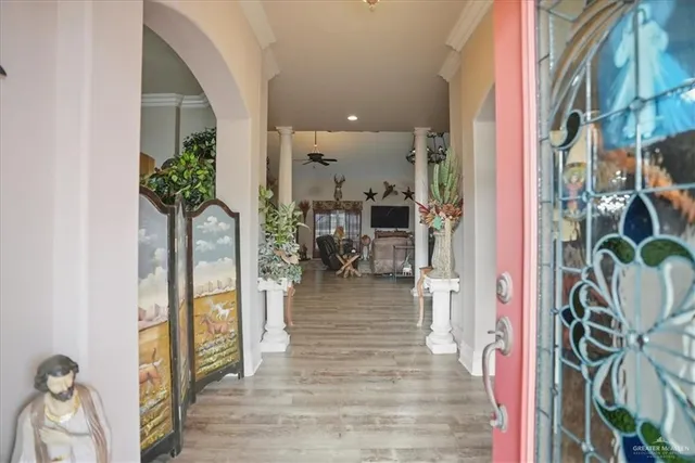 a bedroom with furniture and a chandelier