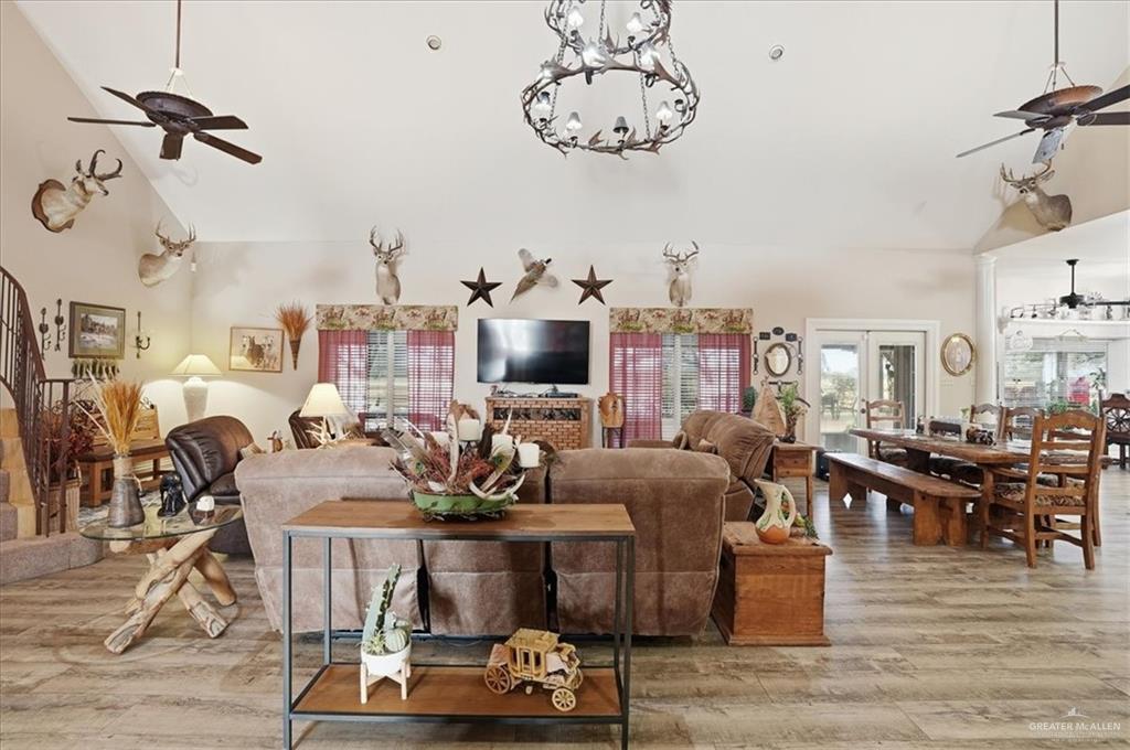 15561 Highway 281 Premont, TX 78375 - Photo 21 of 43 a living room with furniture kitchen view and a chandelier
