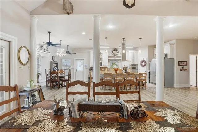 a view of a dining room with furniture and wooden floor