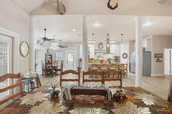 a view of a dining room with furniture and wooden floor