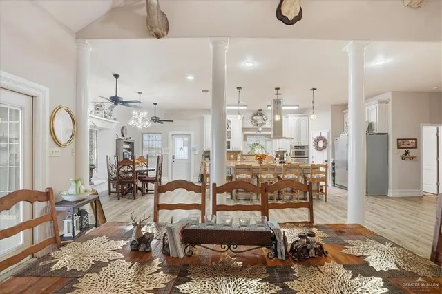 a view of a dining room with furniture and wooden floor
