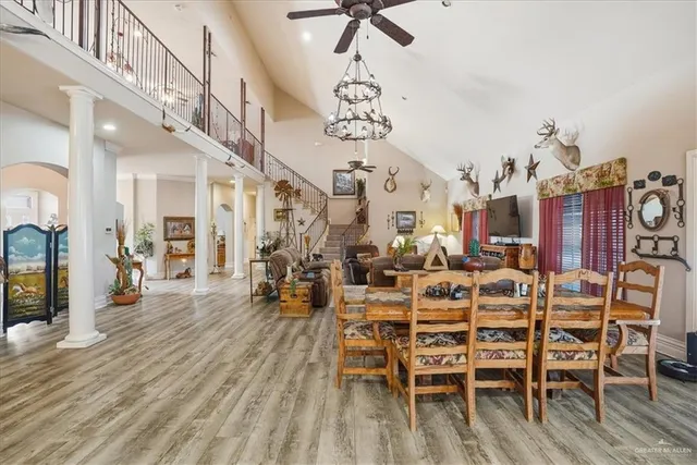 a large kitchen with a table and chairs