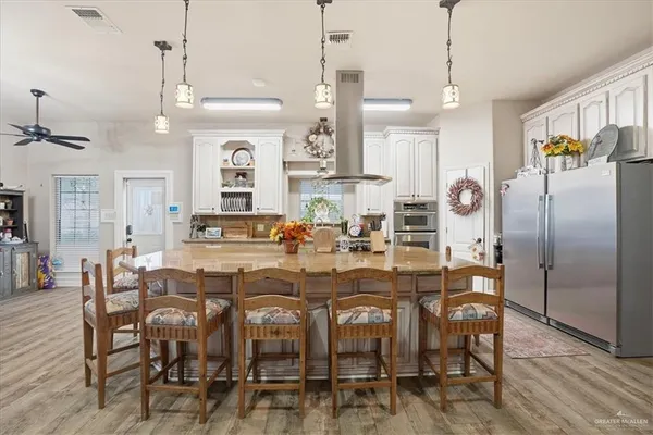 a kitchen with sink a counter and cabinets