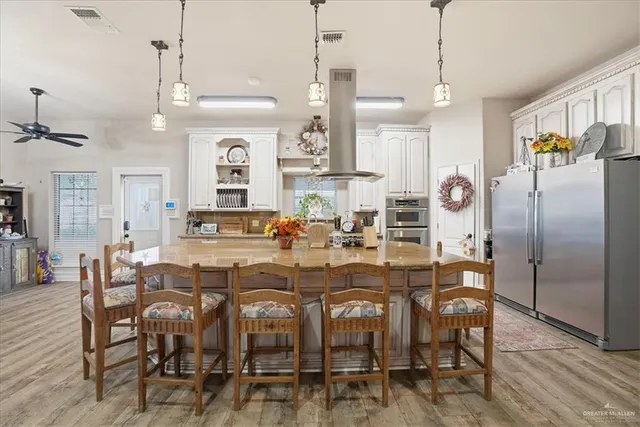 a kitchen with sink a counter and cabinets