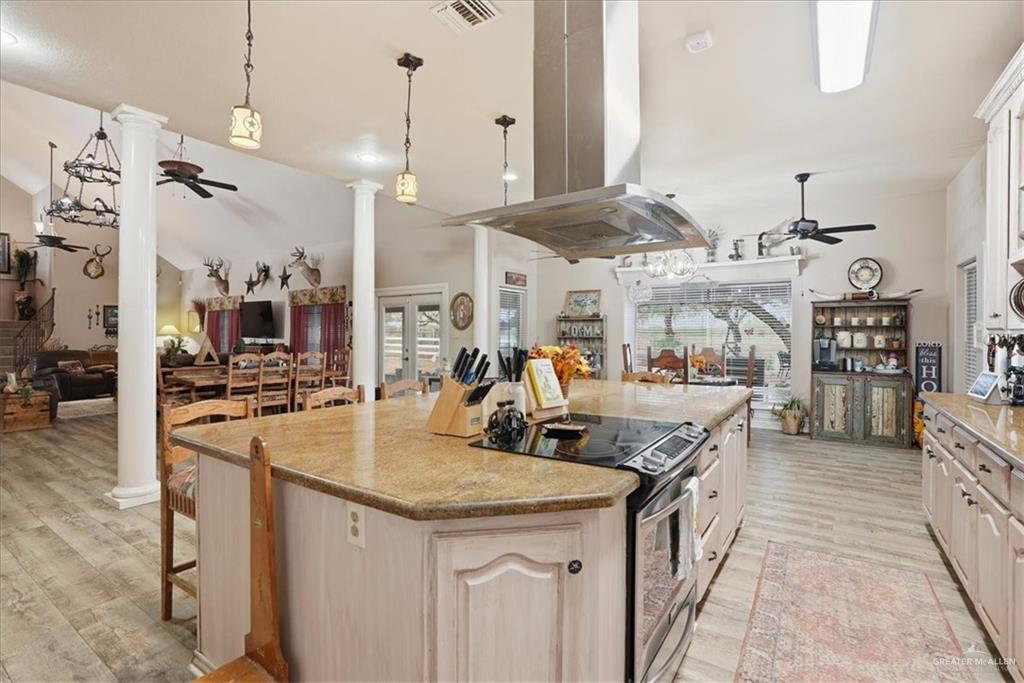 15561 Highway 281 Premont, TX 78375 - Photo 34 of 43 a kitchen with stainless steel appliances granite countertop a sink and a refrigerator