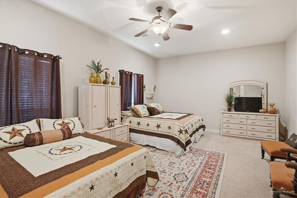 15561 Highway 281 Premont, TX 78375 - Photo 39 of 43 a bedroom with furniture and a window