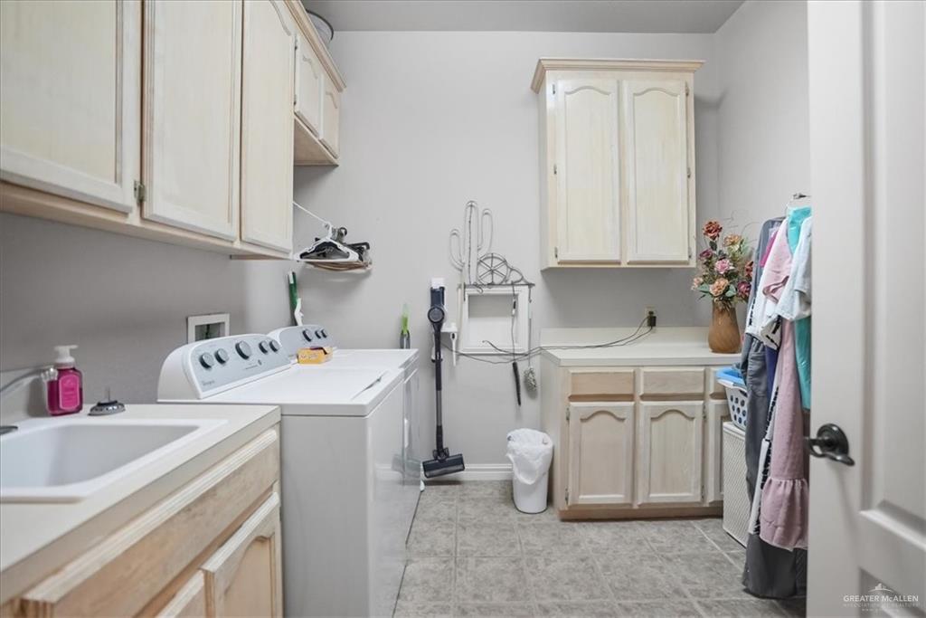 15561 Highway 281 Premont, TX 78375 - Photo 42 of 43 a utility room with dryer and washer