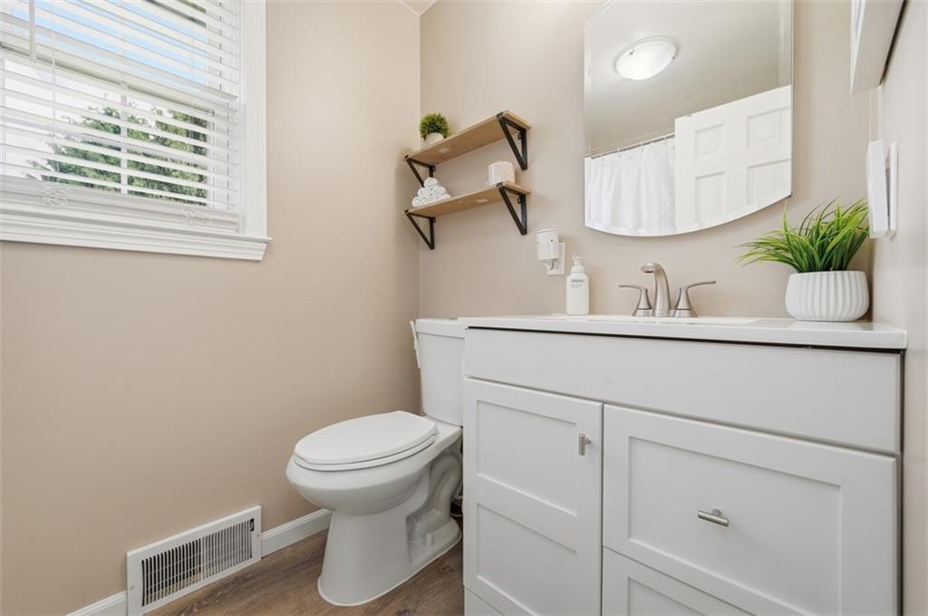 129 Meadowbrook Road Renfrew, PA 16053 - Photo 18 of 45 a bathroom with a toilet sink and mirror