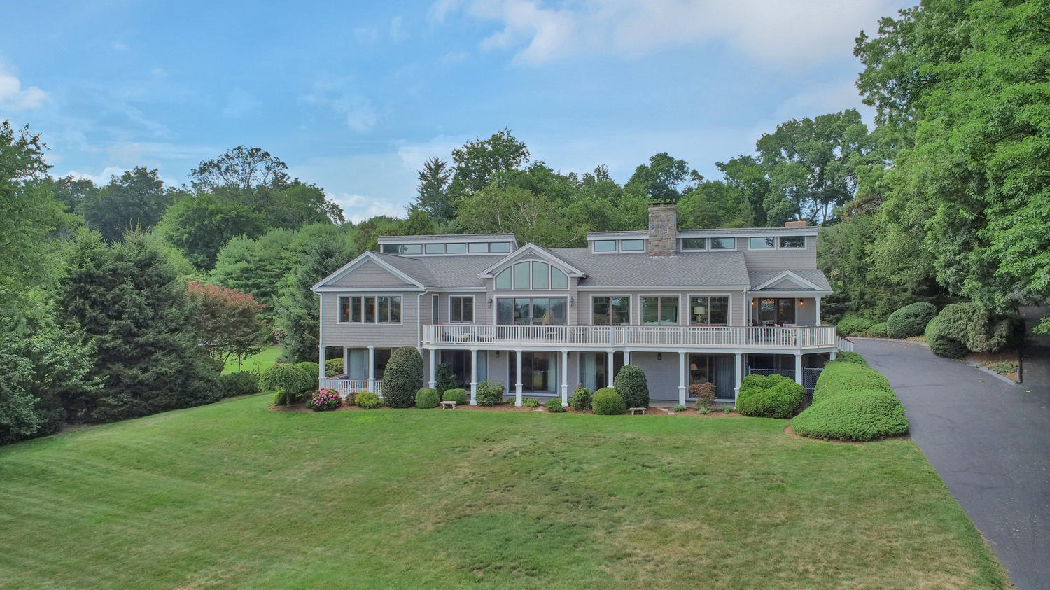 92 Old Saugatuck Road Norwalk, CT 06855 - Photo 1 of 1 a view of a house with a big yard and large trees