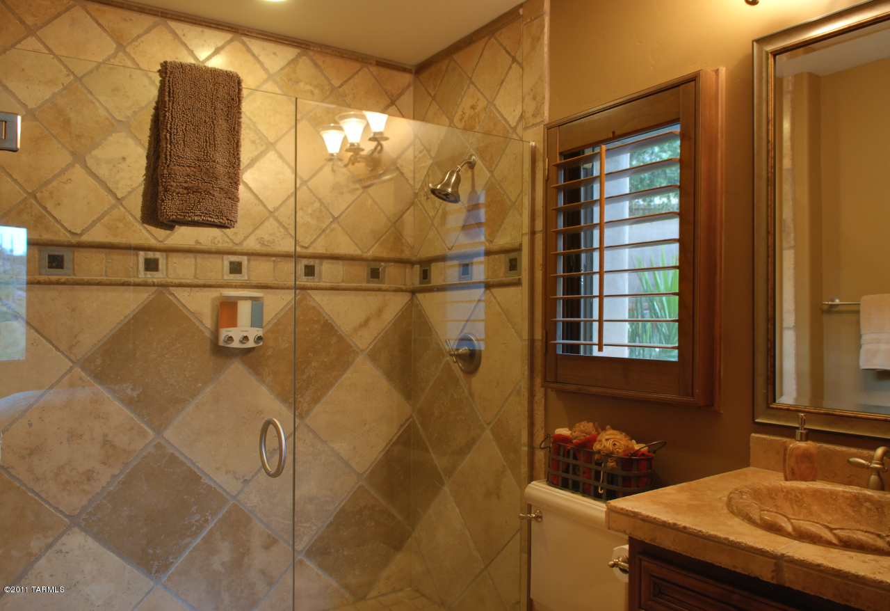 2188 East Buck Ridge Place Oro Valley, AZ 85737 - Photo 19 of 22 a bathroom with a sink and a window