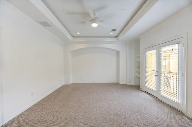 an empty room with a empty space and windows