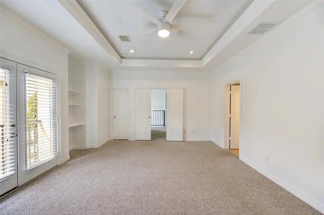 an empty room with windows and closet