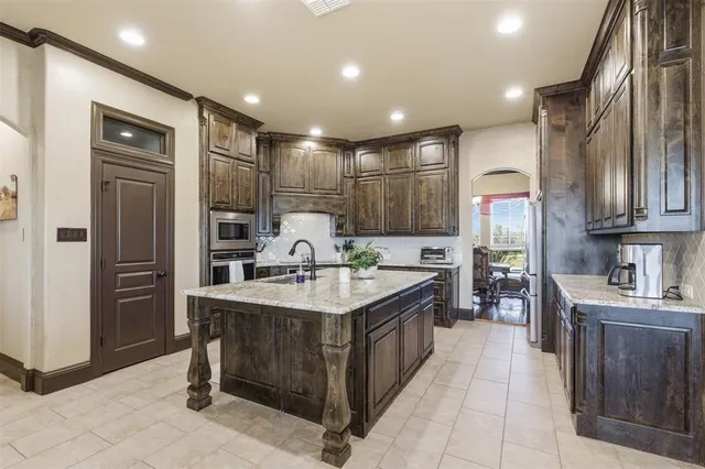 a living room with fireplace furniture and a wooden floor