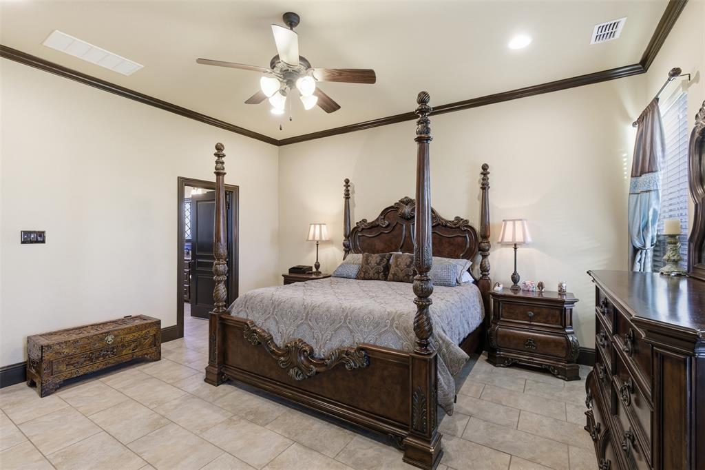 6298 Belz Road Sanger, TX 76266 - Photo 14 of 40 a bedroom with a bed and a ceiling fan