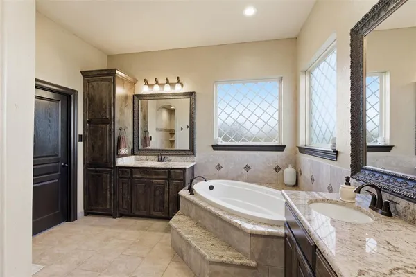 a bedroom with a bed and a ceiling fan