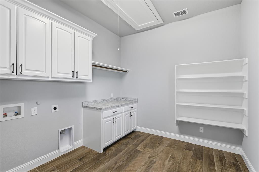 6298 Belz Road Sanger, TX 76266 - Photo 27 of 40 a view of cabinets a sink and dishwasher in a kitchen