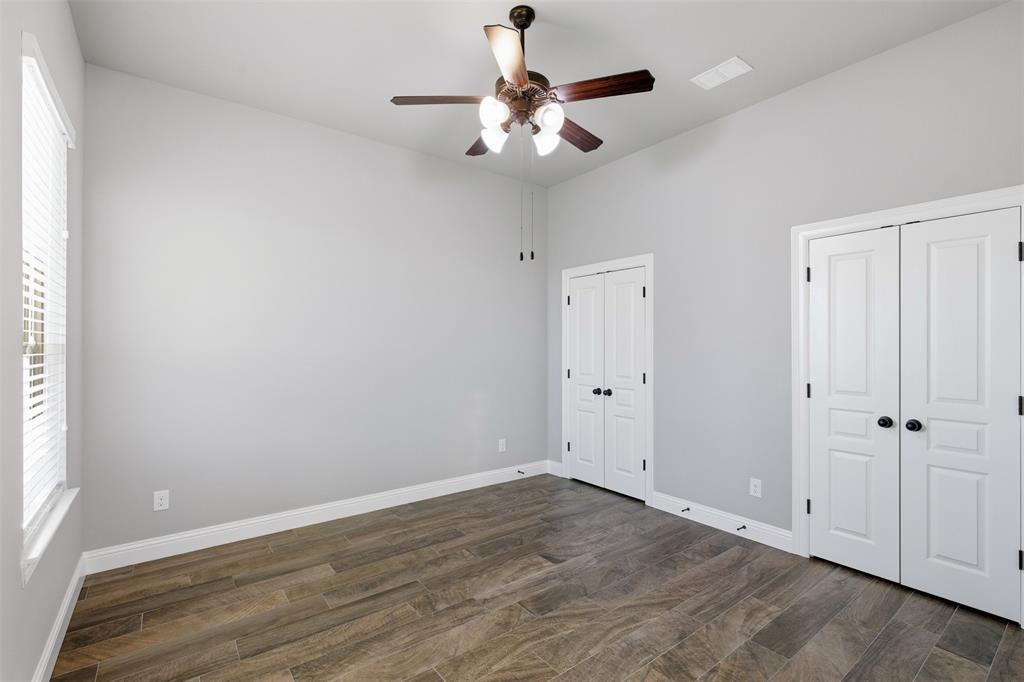 6298 Belz Road Sanger, TX 76266 - Photo 28 of 40 wooden floor in an empty room with a window
