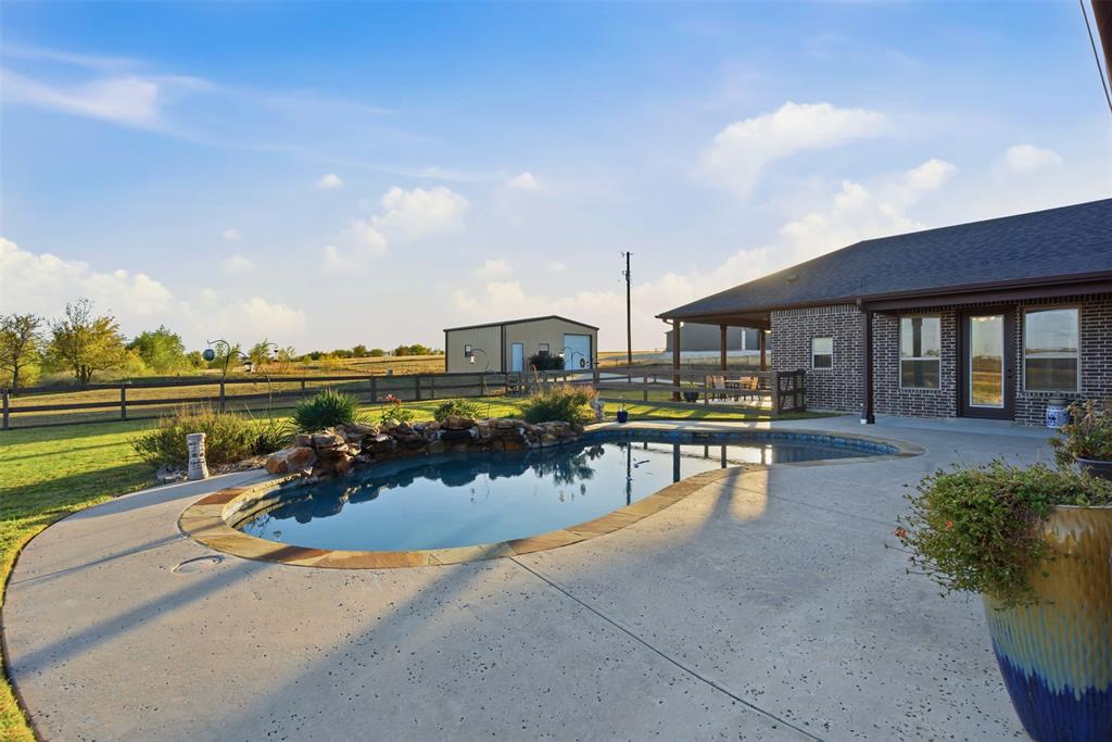6298 Belz Road Sanger, TX 76266 - Photo 29 of 40 a view of a house with swimming pool and sitting area