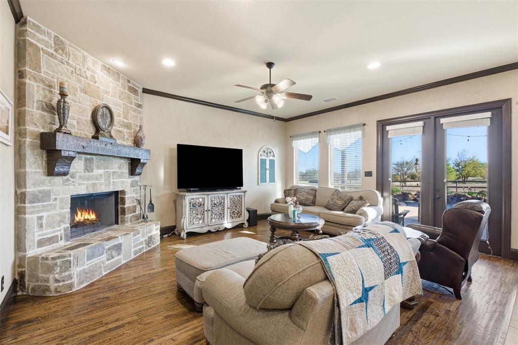 6298 Belz Road Sanger, TX 76266 - Photo 8 of 40 a living room with furniture fireplace and a flat screen tv