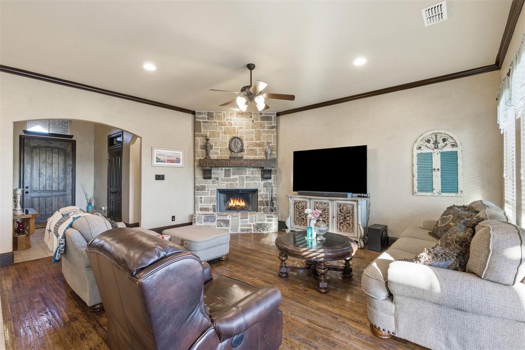 6298 Belz Road Sanger, TX 76266 - Photo 39 of 40 a living room with furniture and a flat screen tv