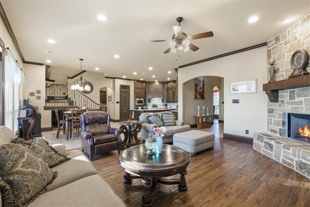 6298 Belz Road Sanger, TX 76266 - Photo 9 of 40 a living room with fireplace furniture and a wooden floor