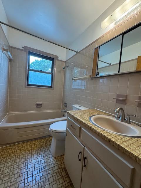4916 Hildebrand Road Northwest Roanoke, VA 24012 - Photo 14 of 24 a bathroom with a granite countertop sink a toilet a mirror and bathtub