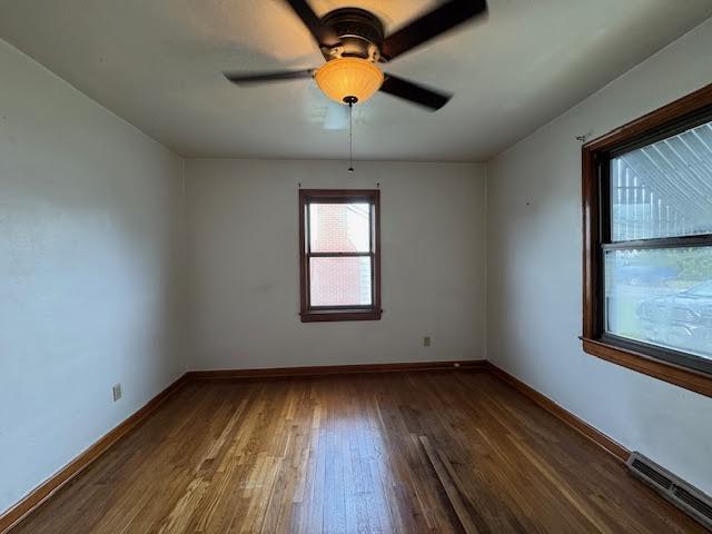 4916 Hildebrand Road Northwest Roanoke, VA 24012 - Photo 15 of 24 an empty room with wooden floor and windows