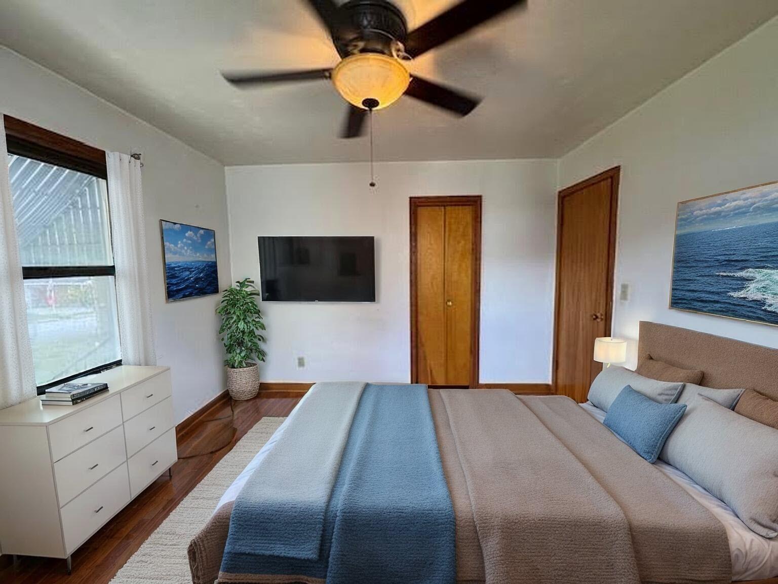 4916 Hildebrand Road Northwest Roanoke, VA 24012 - Photo 10 of 24 a bedroom with a bed and a flat screen tv