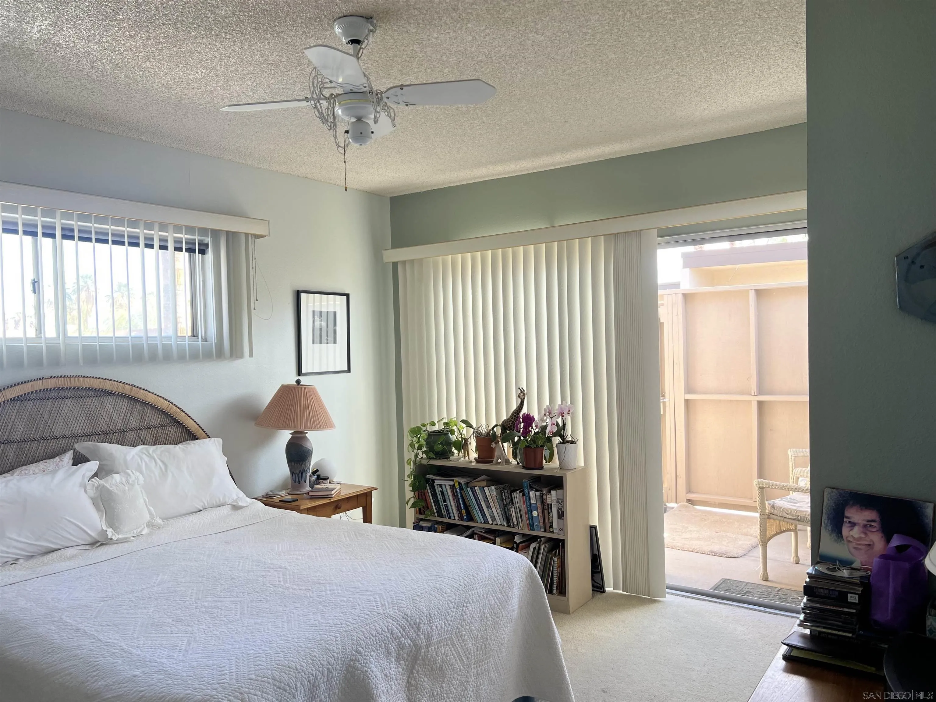3189 Club Circle Borrego Springs, CA 92004 - Photo 13 of 30 a bedroom with a bed and a chandelier