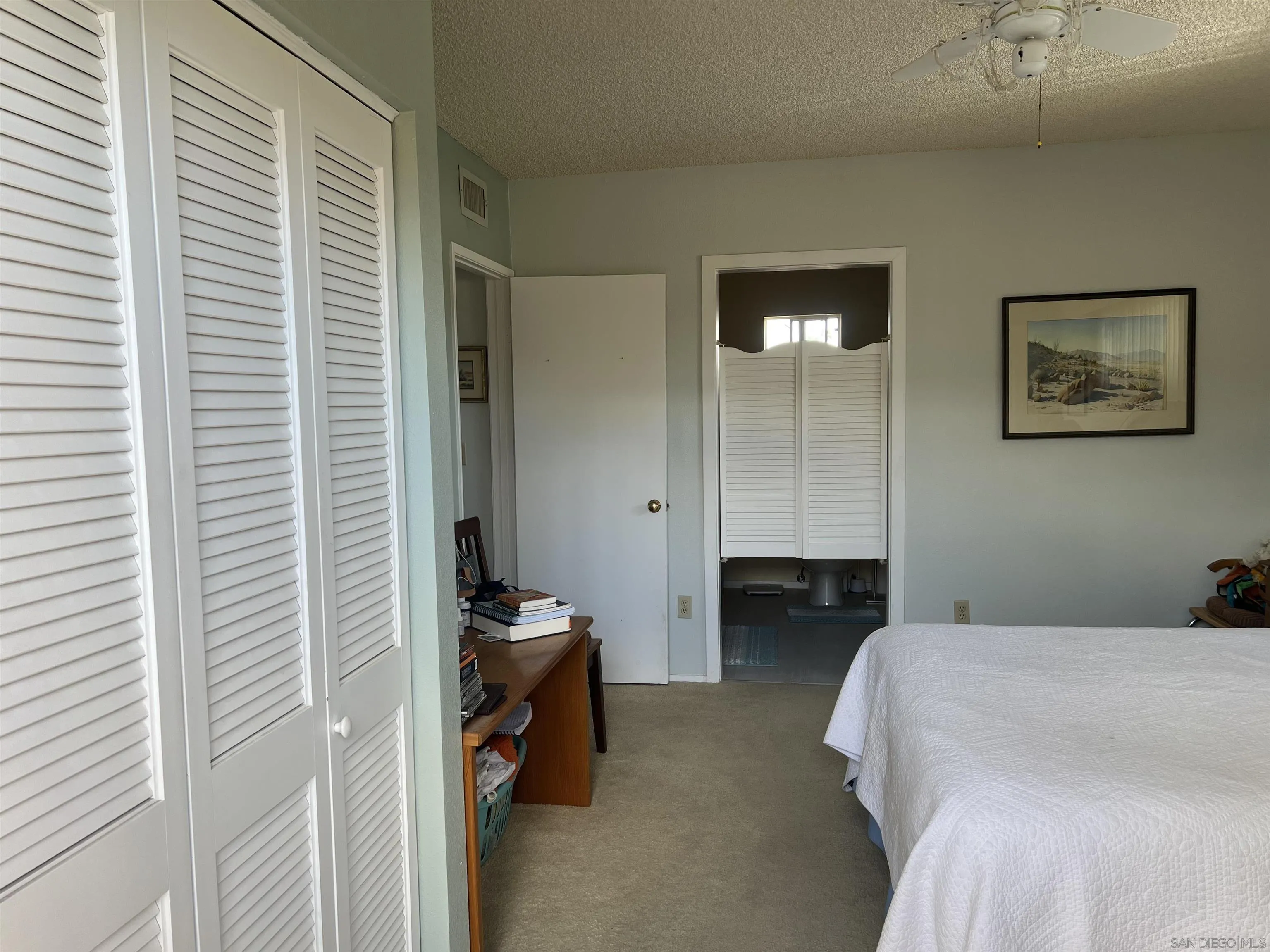 3189 Club Circle Borrego Springs, CA 92004 - Photo 14 of 30 a bedroom with a bed and a cabinets