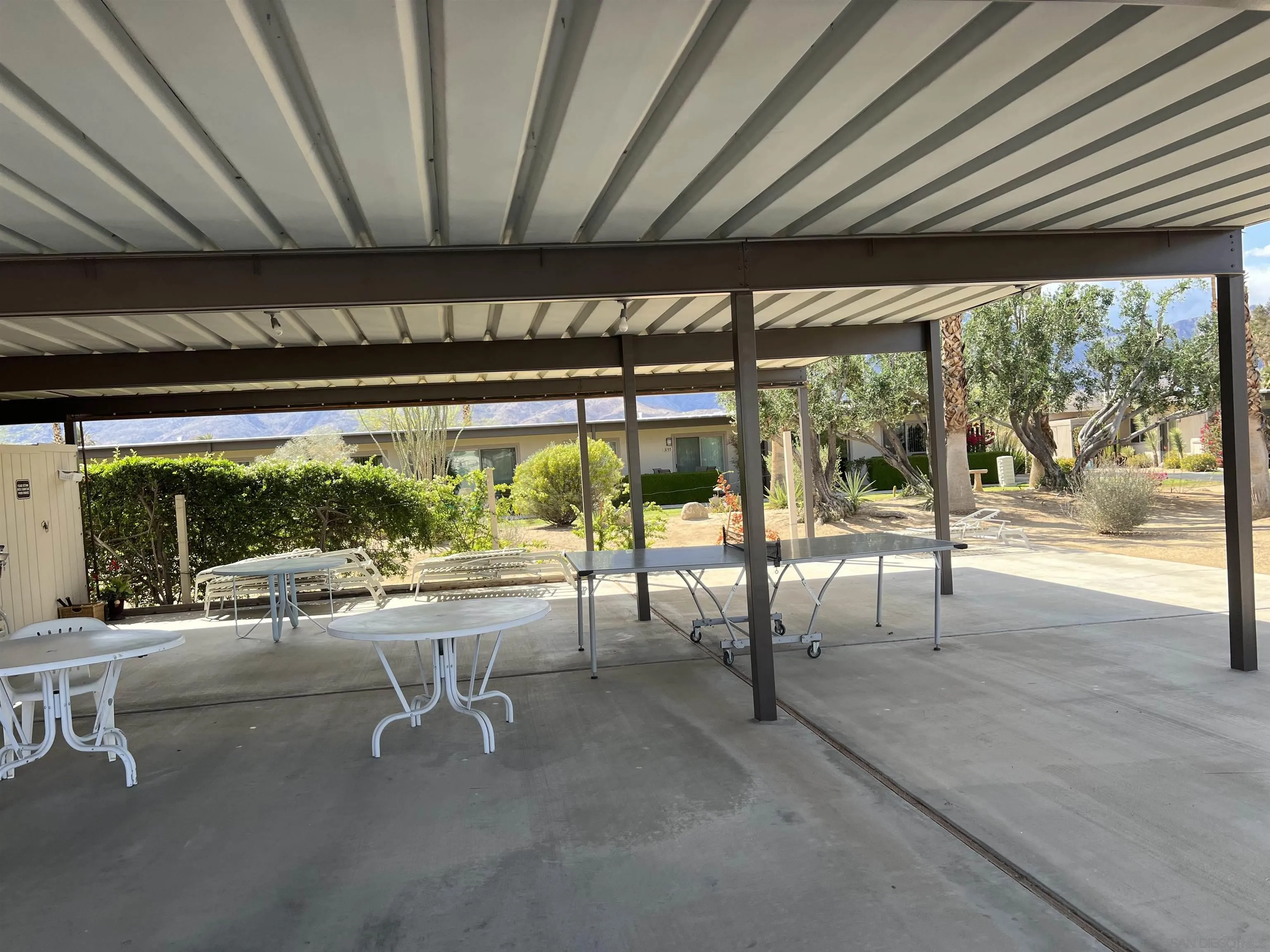 3189 Club Circle Borrego Springs, CA 92004 - Photo 21 of 30 a view of a porch with chairs and backyard