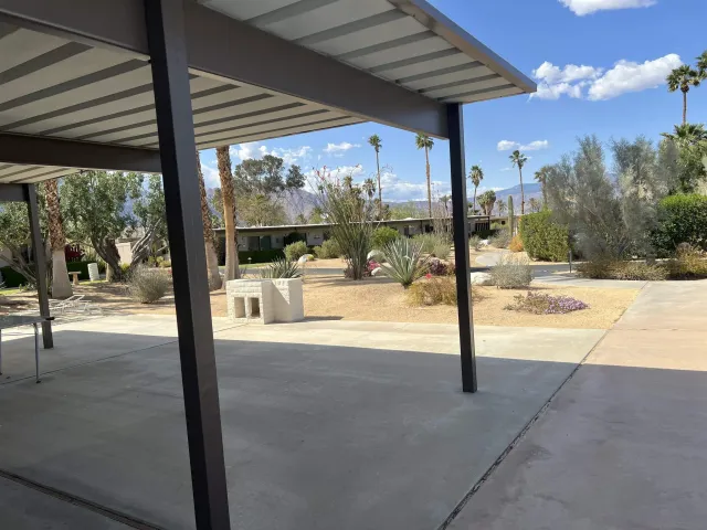 a view of a swimming pool with a patio