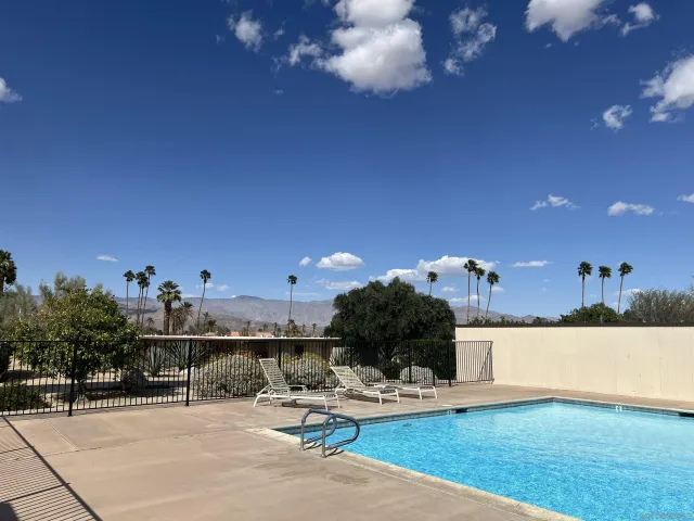 a view of a living room and kitchen