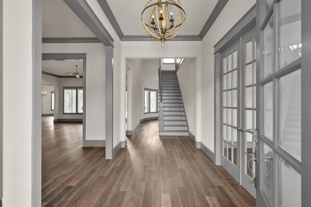 a view of an entryway with wooden floor