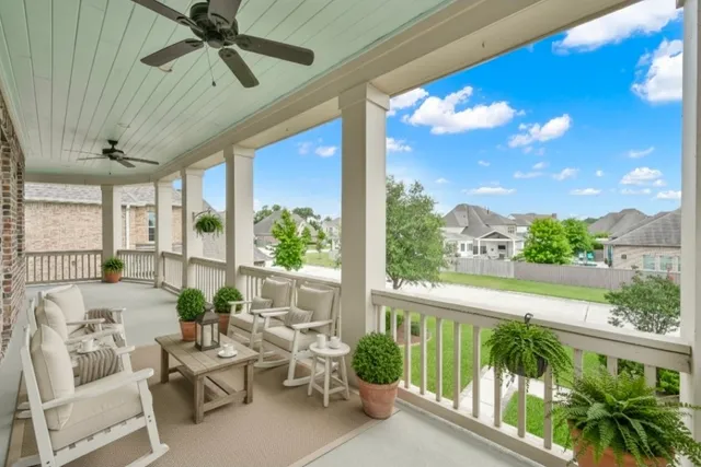 a view of a balcony with furniture