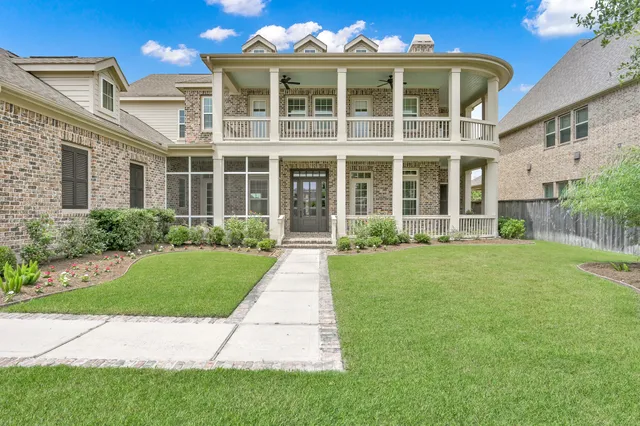 a front view of a building with garden