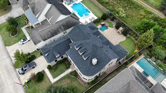 an aerial view of a backyard with outdoor space
