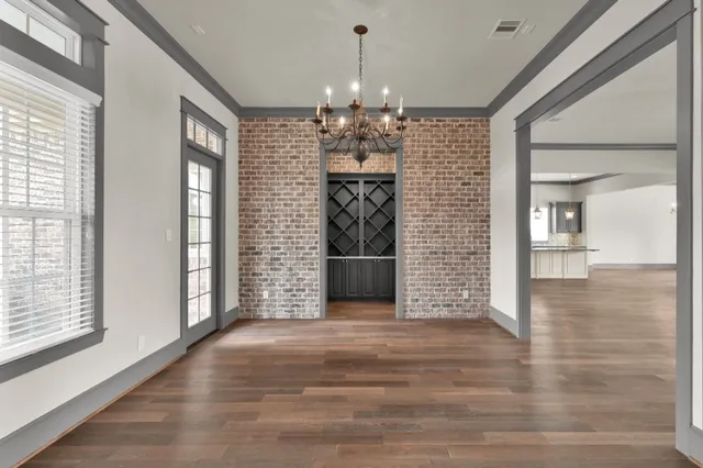 a view of a room with window and wooden floor