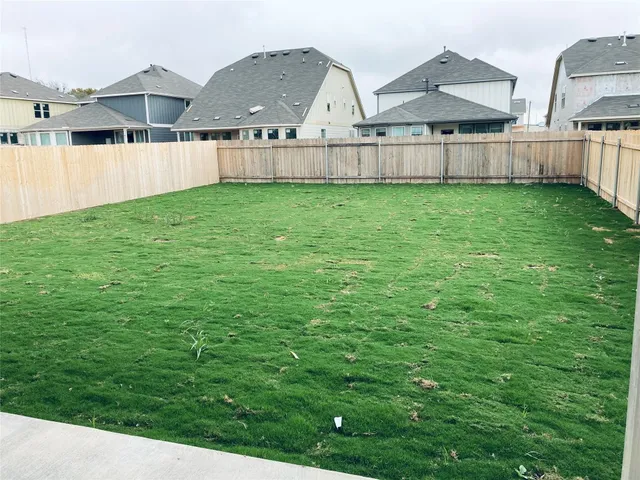 a view of a back yard of the house