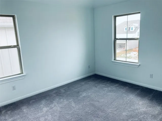 a kitchen with a sink a microwave and refrigerator