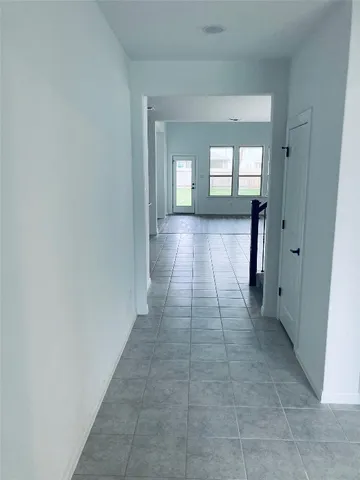 a view of hallway with a front door