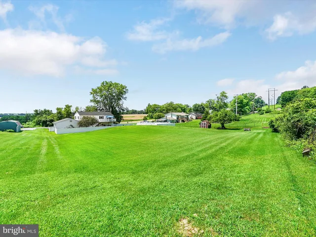 a view of a chairs and table on the wooden floor
