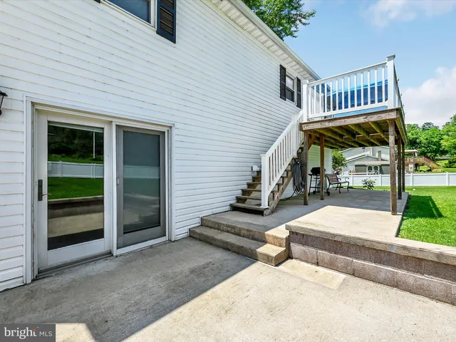 a view of a wooden deck and city view